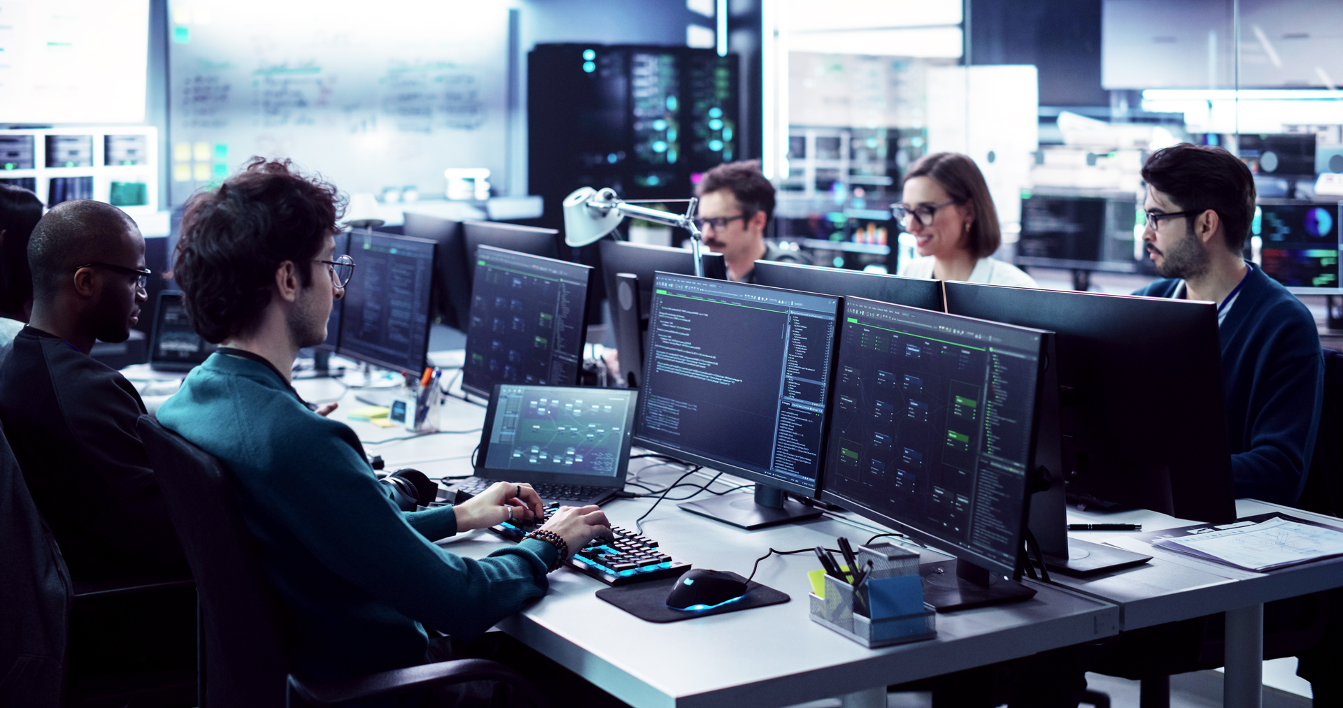 A team of programmers working on their computers